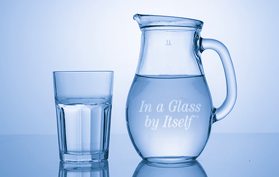 water pitcher etched with "In a Glass by Itself"