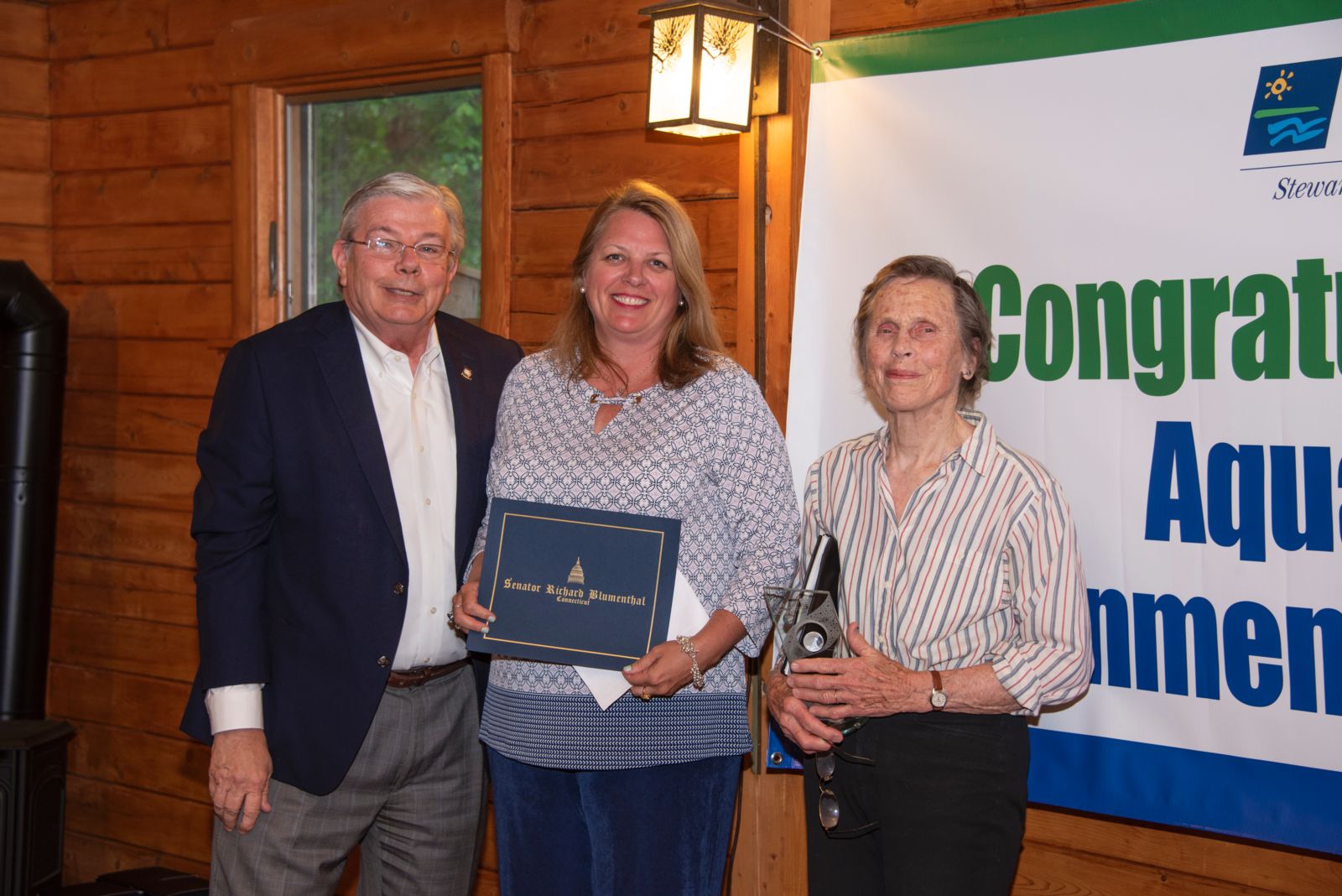 PURA Vice Chairman John Betkoski and Lynn Shavinksy and Joy Shaw (Accepting for Mary Hogue)